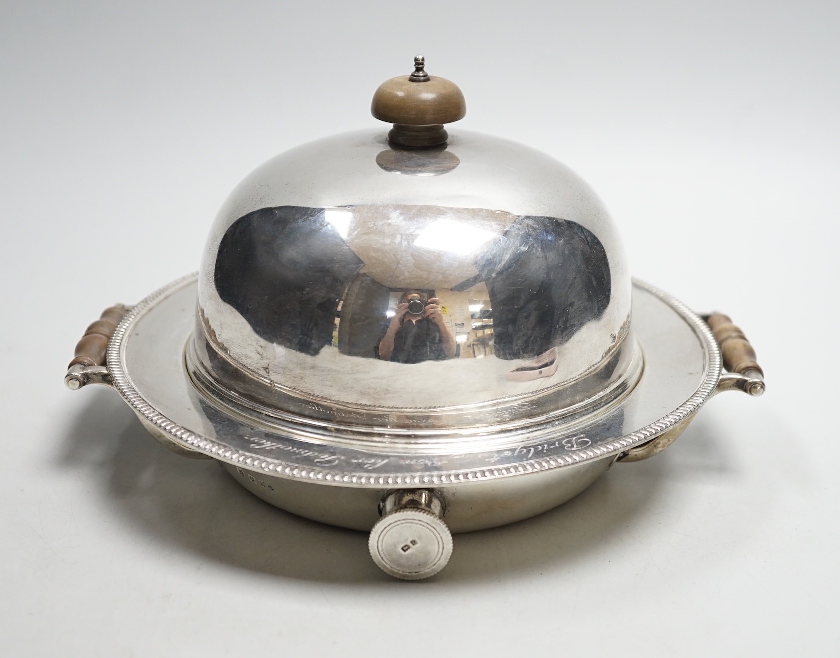 A George V silver circular two handled warming dish and cloche, by J. Parkes & Co, London, 1930, with engraved inscription, width 20.8cm, gross weight 34.4oz.